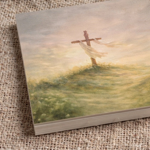 Close-up of a card corner showing the thick archival stock, the artwork printed to the very edge